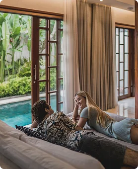 Couple relaxing in a serene poolside bedroom
